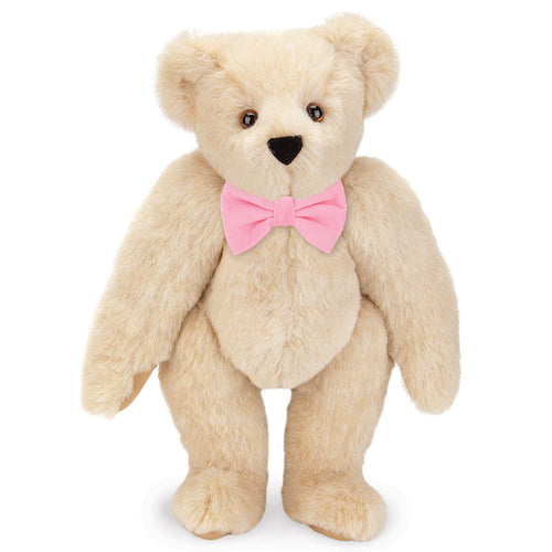 15-inch honey-colored plush teddy bear with brown eyes and a soft pink bow tie.